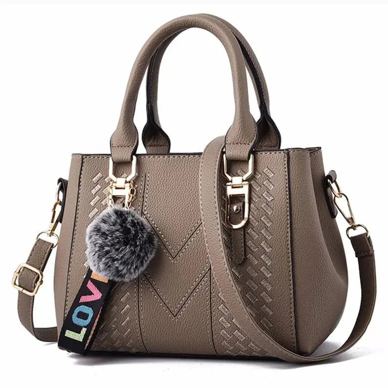 sac à main sangle ajustable pompon